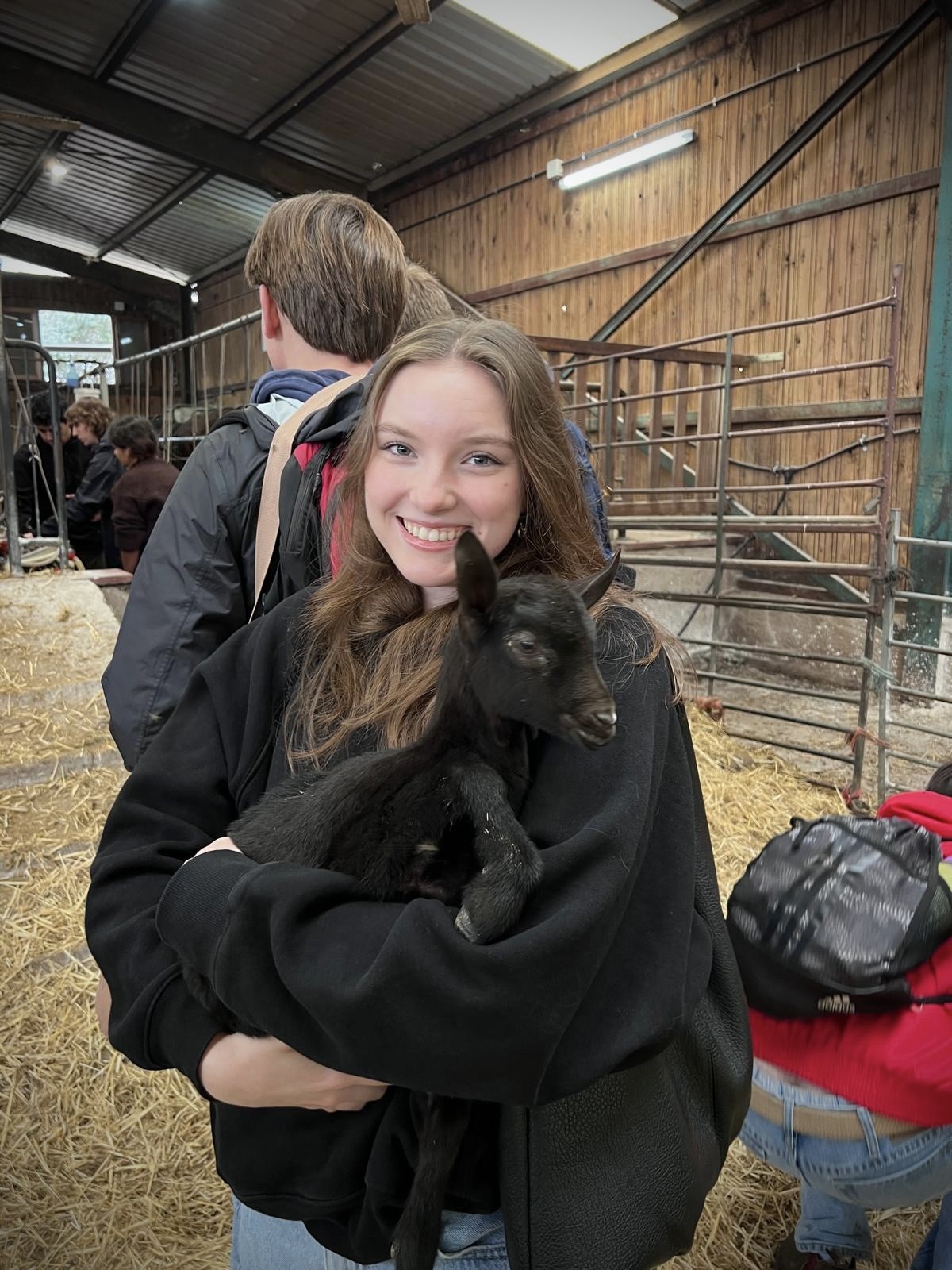 Brooklyn holding a farm animal