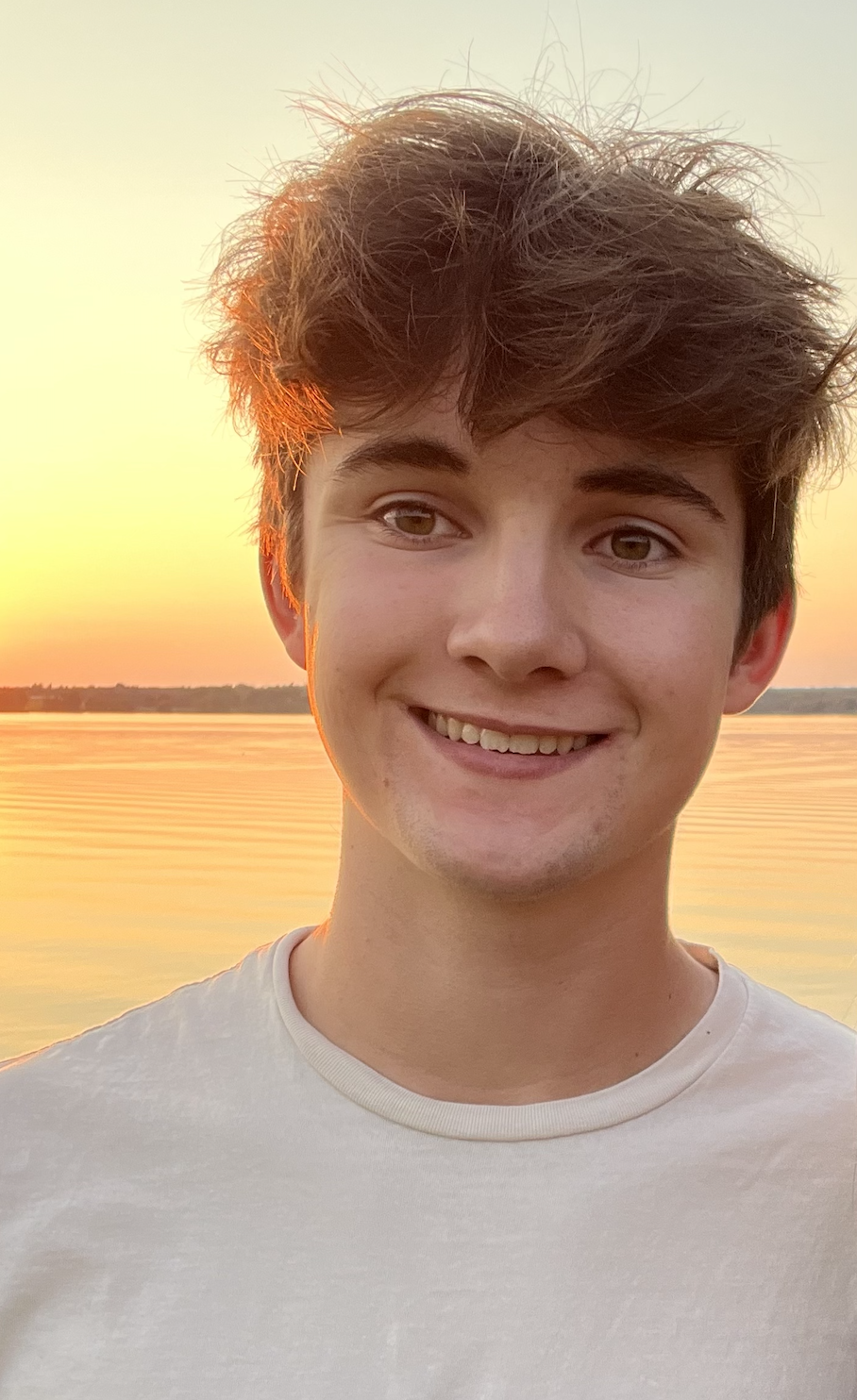 Cooper in front of a beach sunset