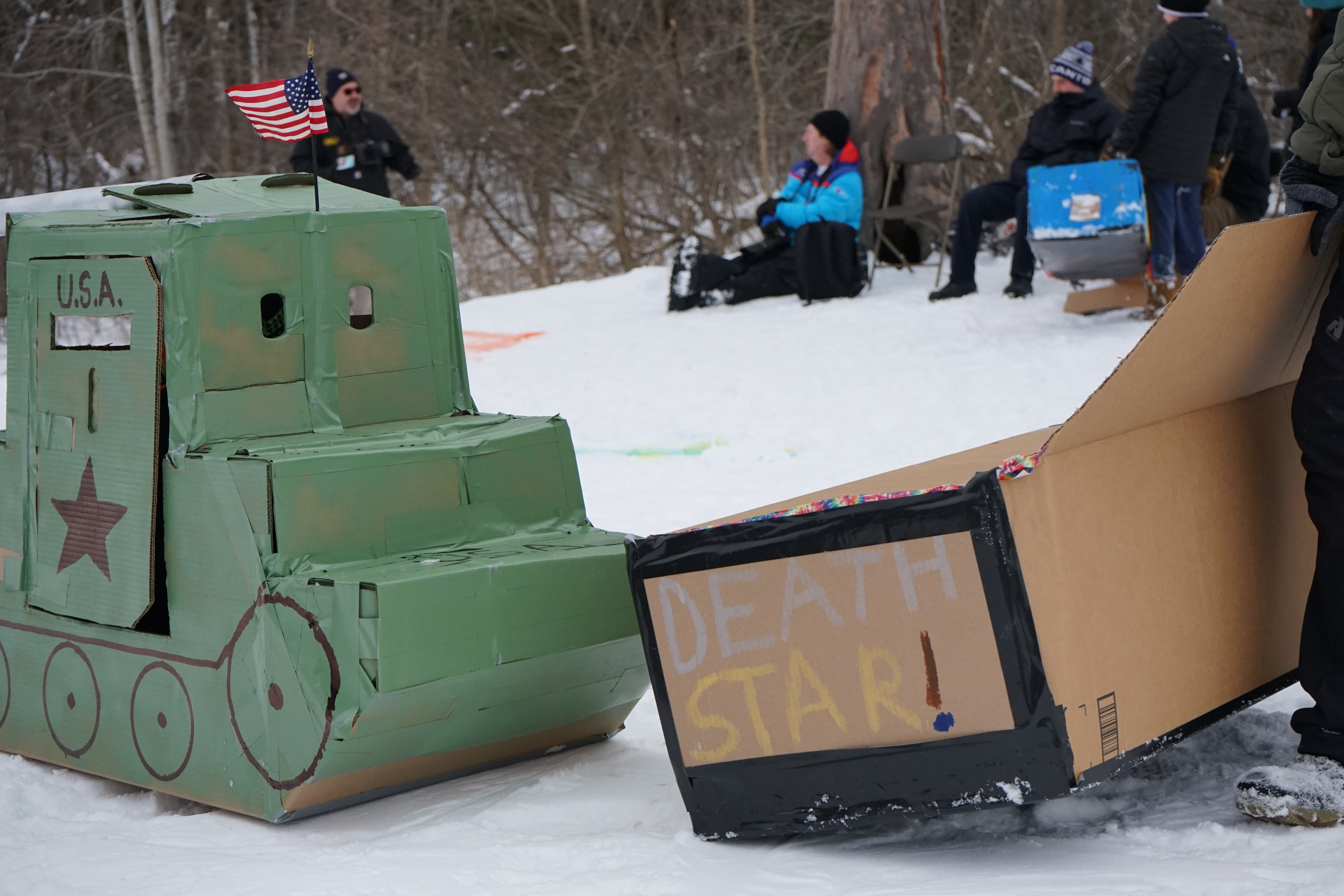 A tank and Death Star sled next to each other.