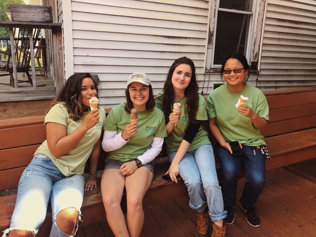 Nature Up North summer naturalist interns, posing while eating ice cream