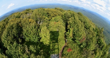 An extremely wide image of the horizon from a fire tower.