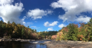 Panoramic river view with fall foliage