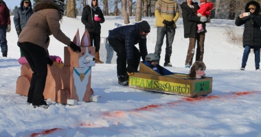 Corgi and Sasquatch sleds square off