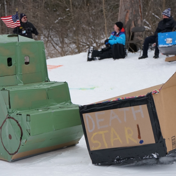 A tank and Death Star sled next to each other.