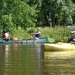 Paddlers in a kayak and canoe